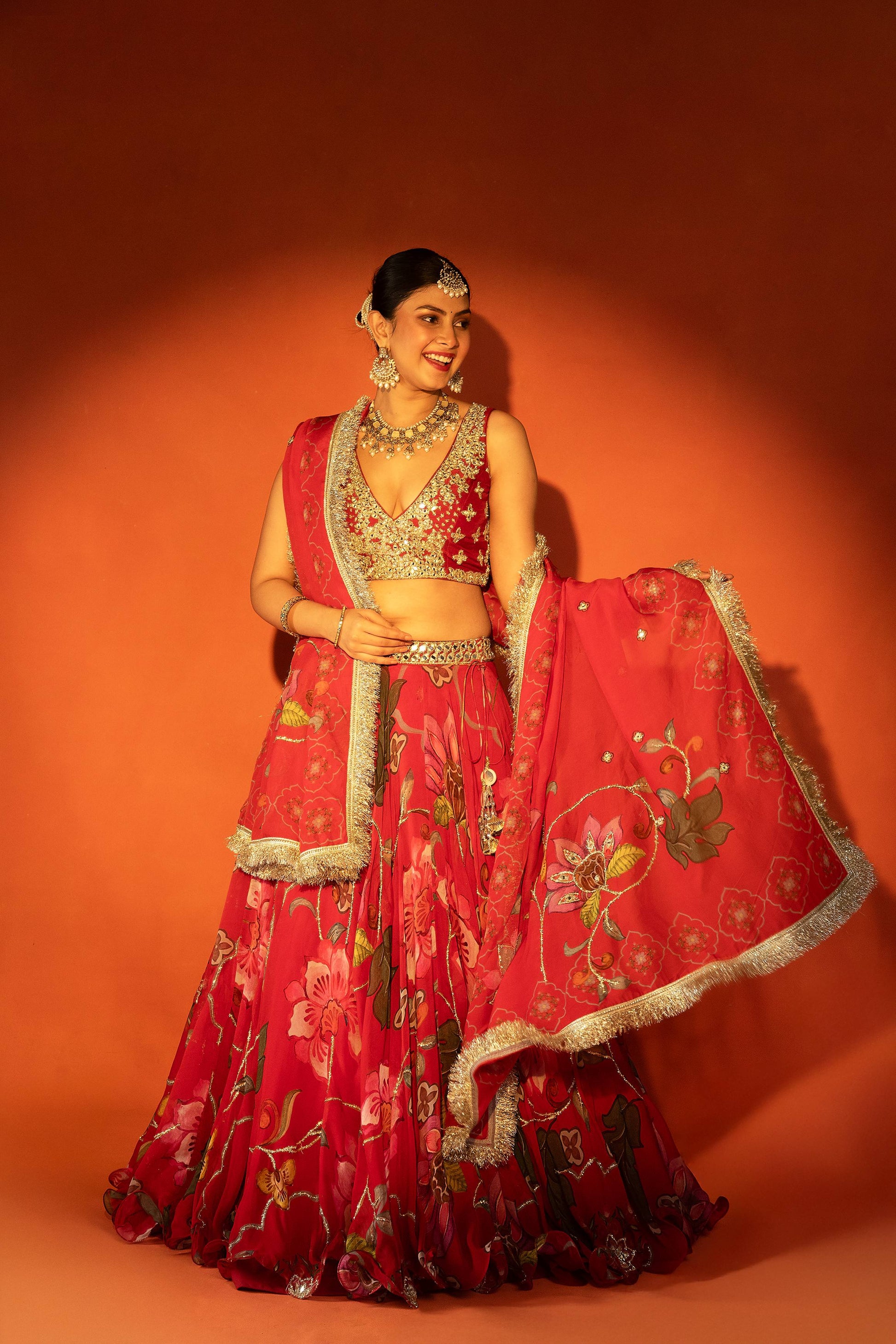 Red floral lehenga with mirror-work blouse and placement dupatta