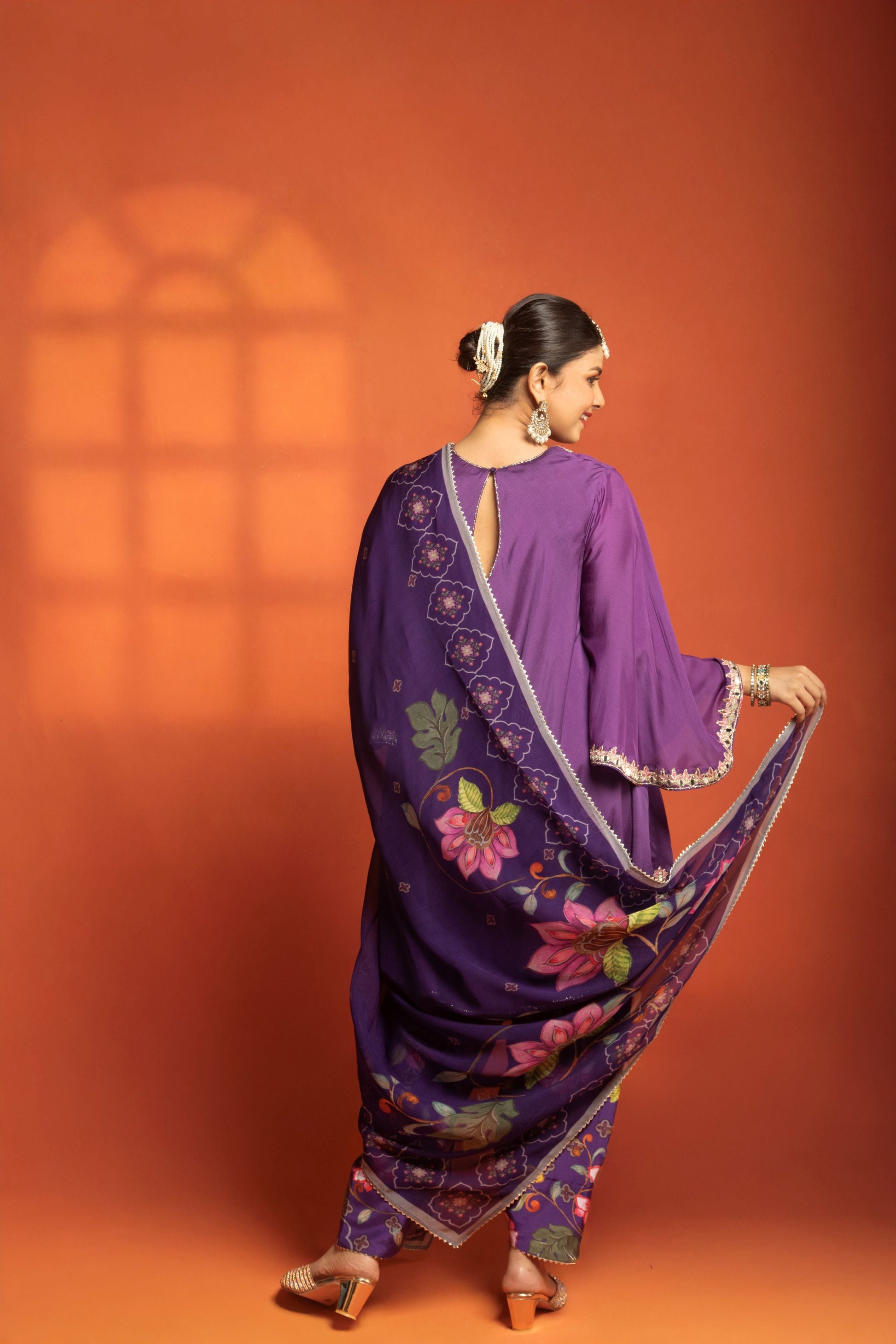 Purple Short Semi- Anarkali with a heavily Embroidered Neckline, Paired with Floral Printed Salwar Pants & Dupatta